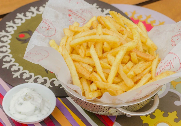 Crispy fries basket with spicy garlic dip